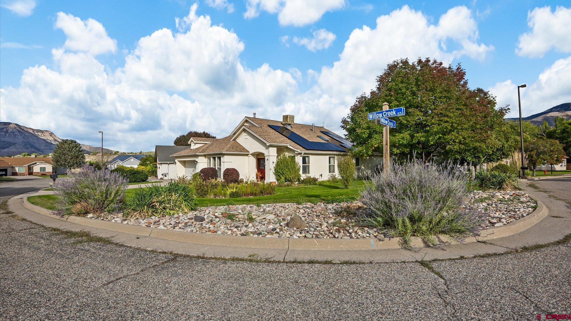 18 Willow Creek Court Parachute, CO 81635 - Photo 2 of 31 a front view of a house with a yard and garage