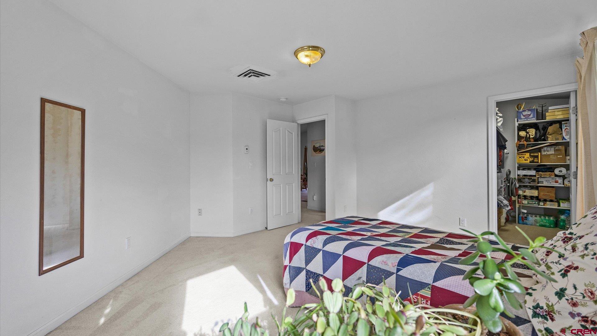 18 Willow Creek Court Parachute, CO 81635 - Photo 24 of 31 a bedroom with a bed and a book shelf