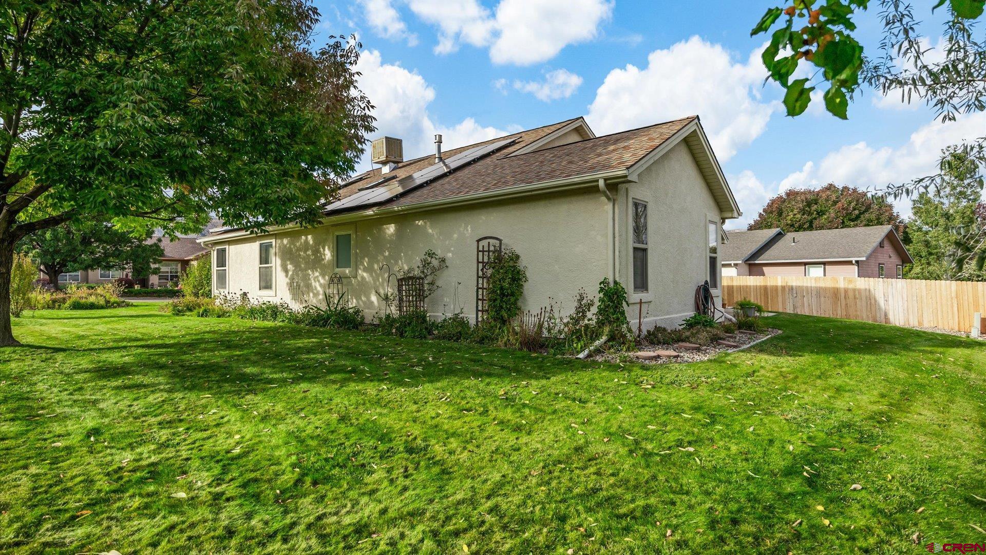 18 Willow Creek Court Parachute, CO 81635 - Photo 30 of 31 a view of a backyard with plants and a large tree