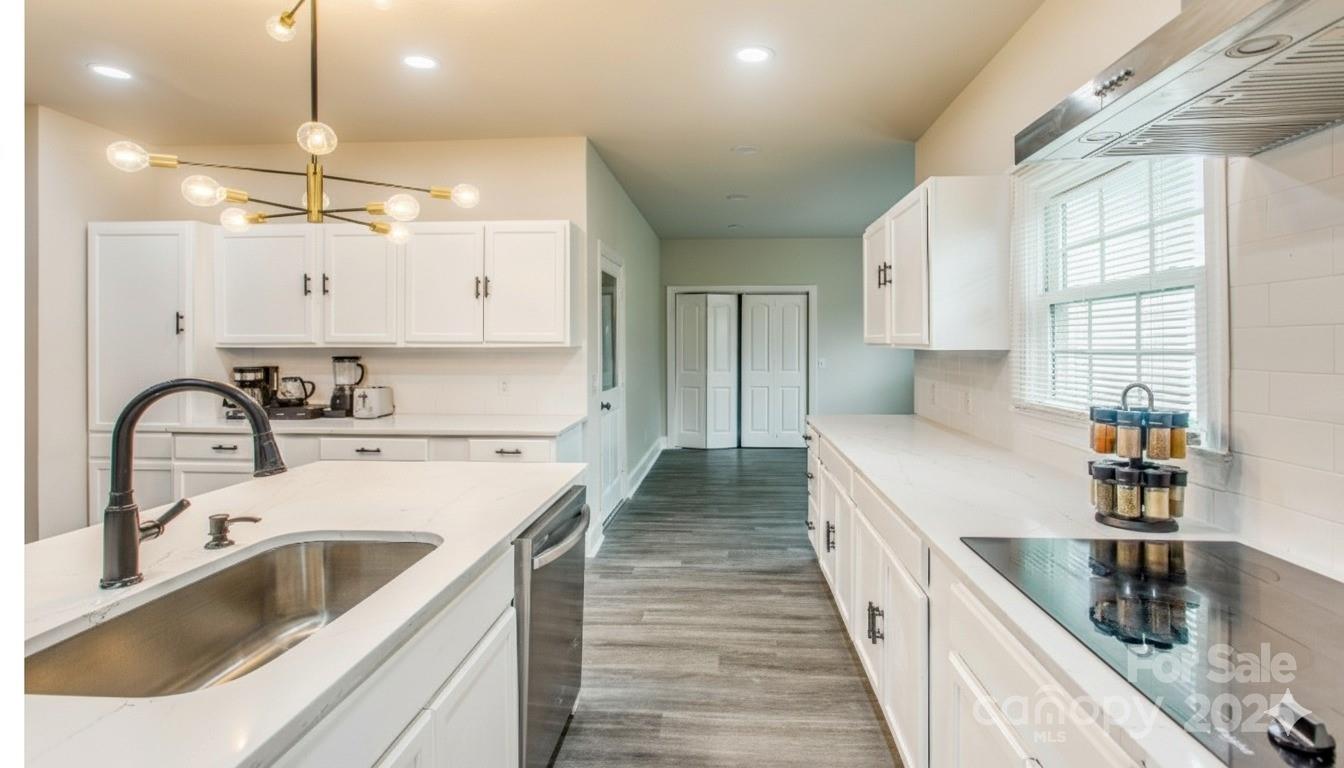 400 Millstone Road Florence, SC 29505 - Photo 14 of 48 a kitchen with a sink stove and cabinets