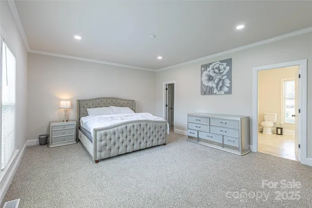 a bedroom with a bed and cabinets