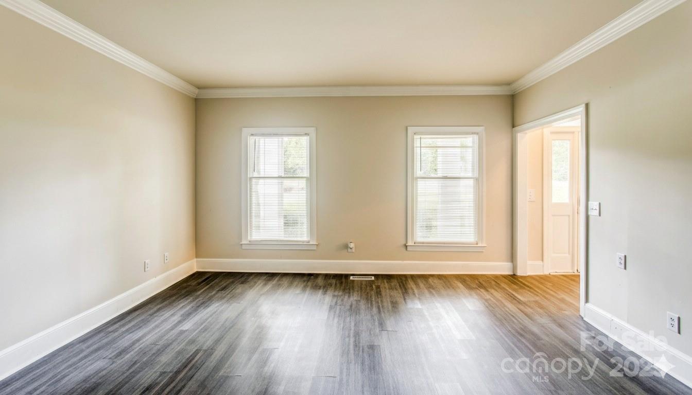 400 Millstone Road Florence, SC 29505 - Photo 19 of 48 an empty room with wooden floor and window
