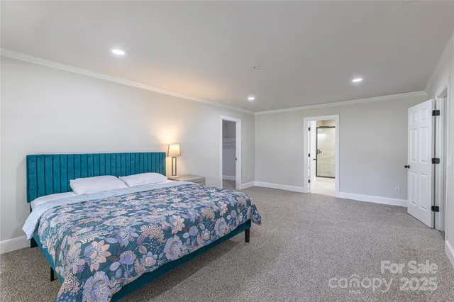 a bedroom with a bed and a night stand