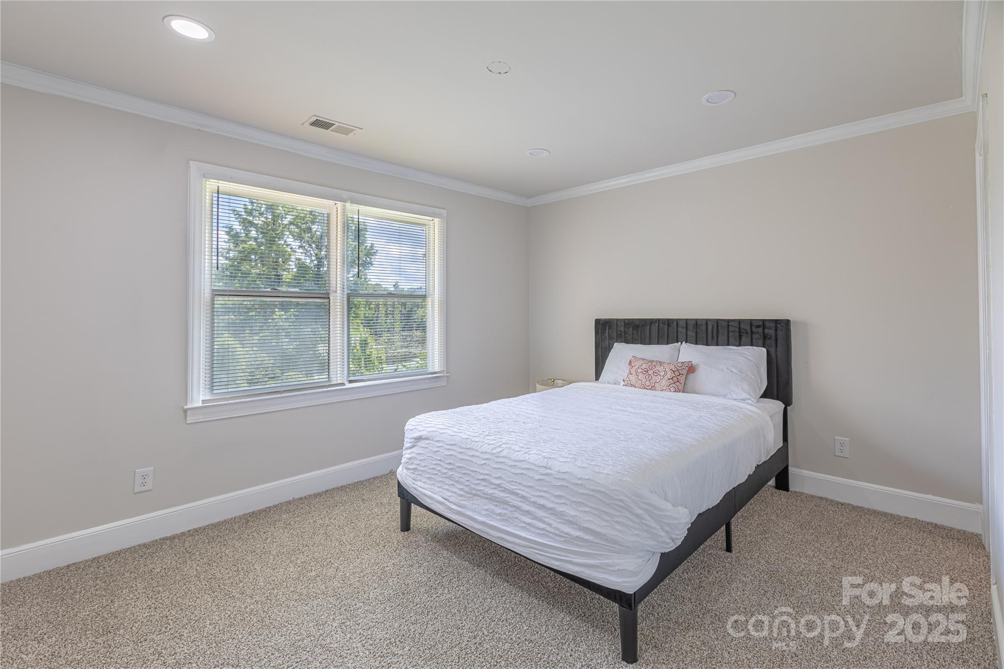 400 Millstone Road Florence, SC 29505 - Photo 22 of 48 a bedroom with a bed lamp and window