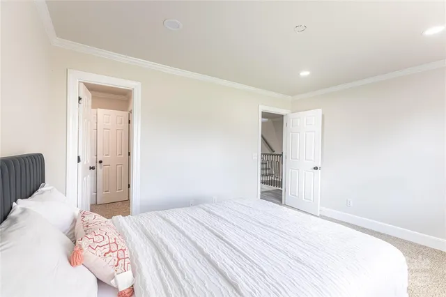 a bedroom with a bed and a mirror