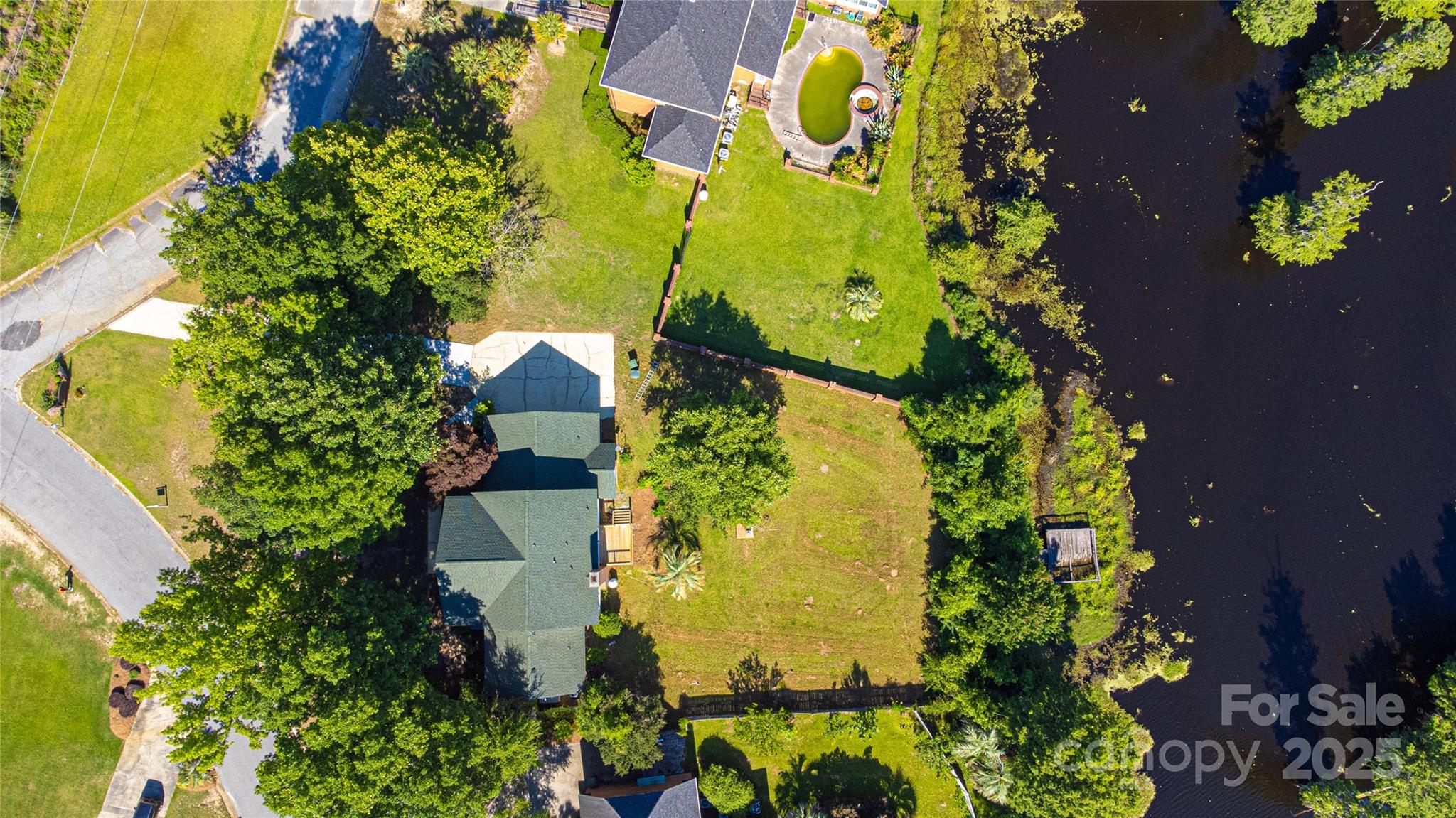 400 Millstone Road Florence, SC 29505 - Photo 30 of 48 an aerial view of a house with a yard and garden