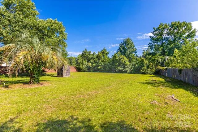a view of a swimming pool with an outdoor space and seating area