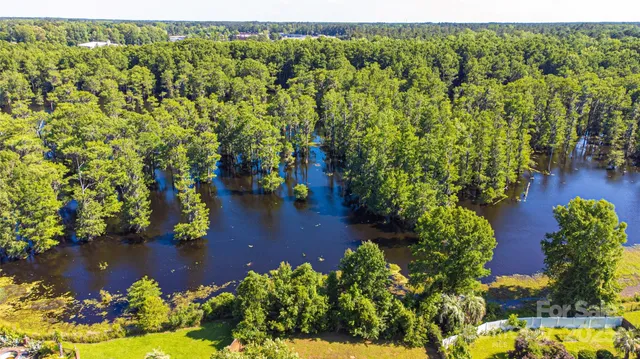 a view of a lake with a yard