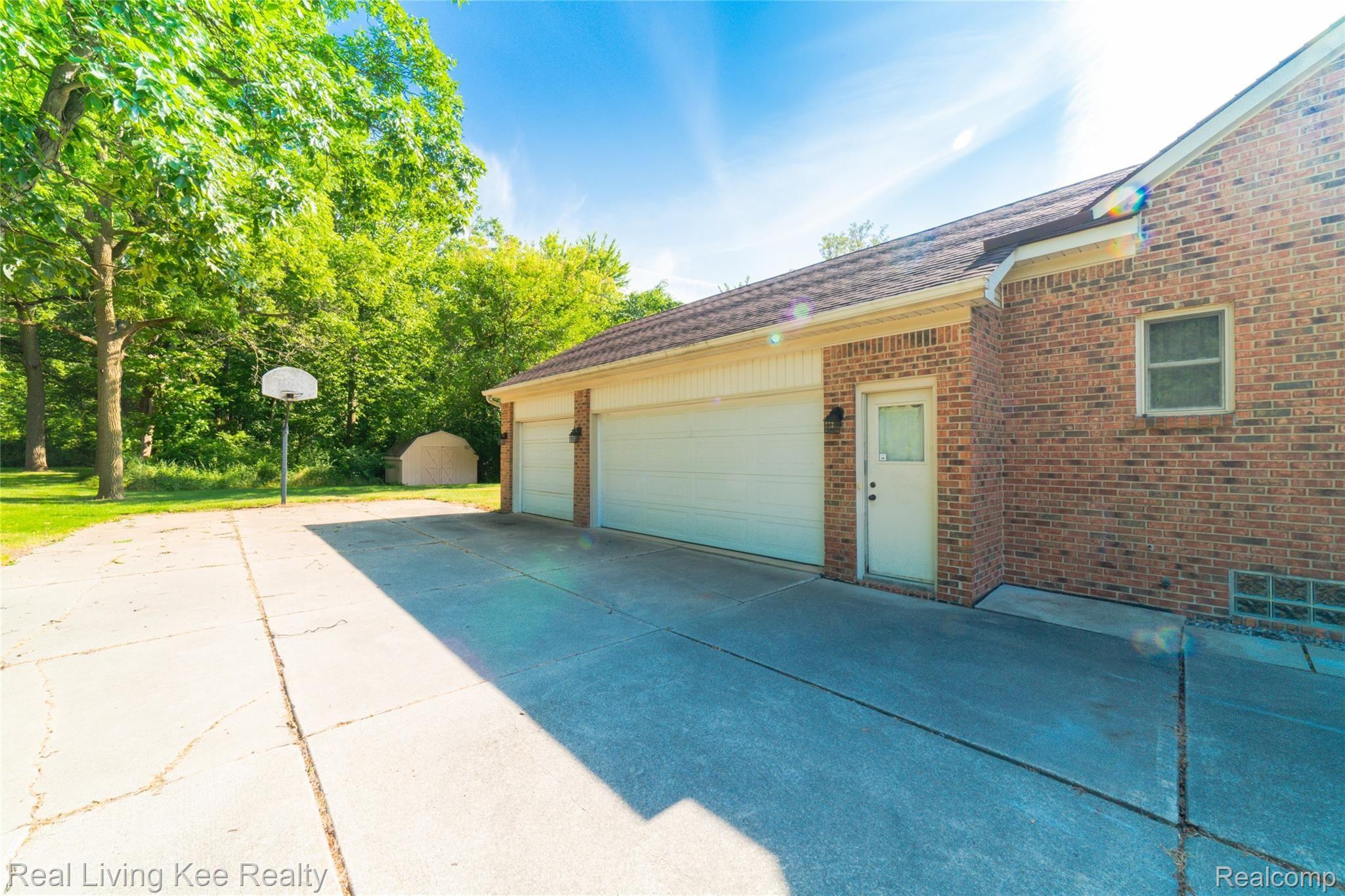 1242 Ruby Avenue Rochester, MI 48309 - Photo 28 of 35 3 1/2 car garage with 2 service doors, one leading to the back yard not shown