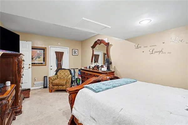 a bedroom with bed and tv