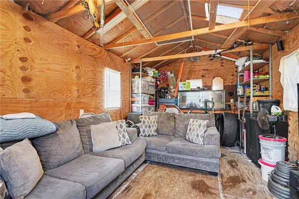 a view of livingroom with furniture and a couch