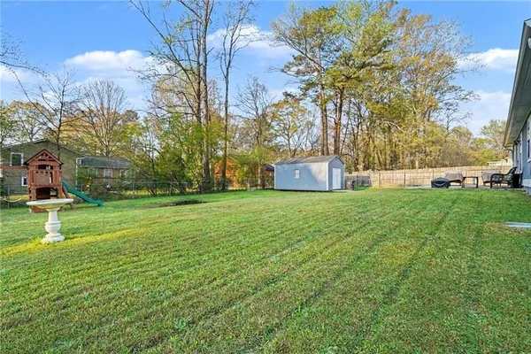 a view of a park with large trees