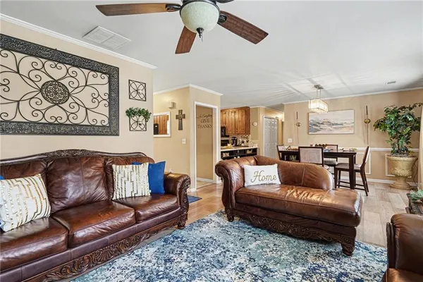 a living room with furniture and a rug