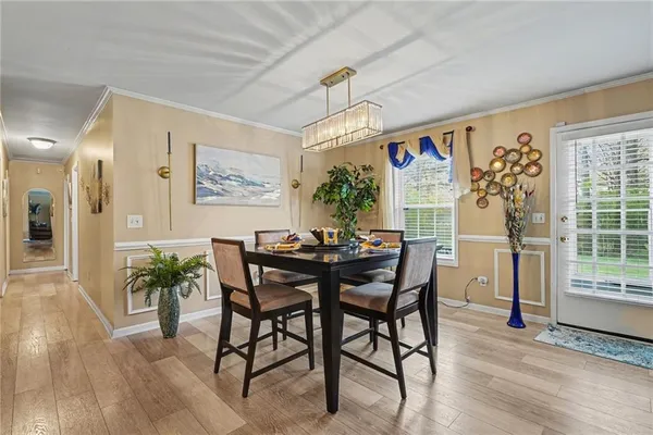 a view of a dining room with furniture window and wooden floor