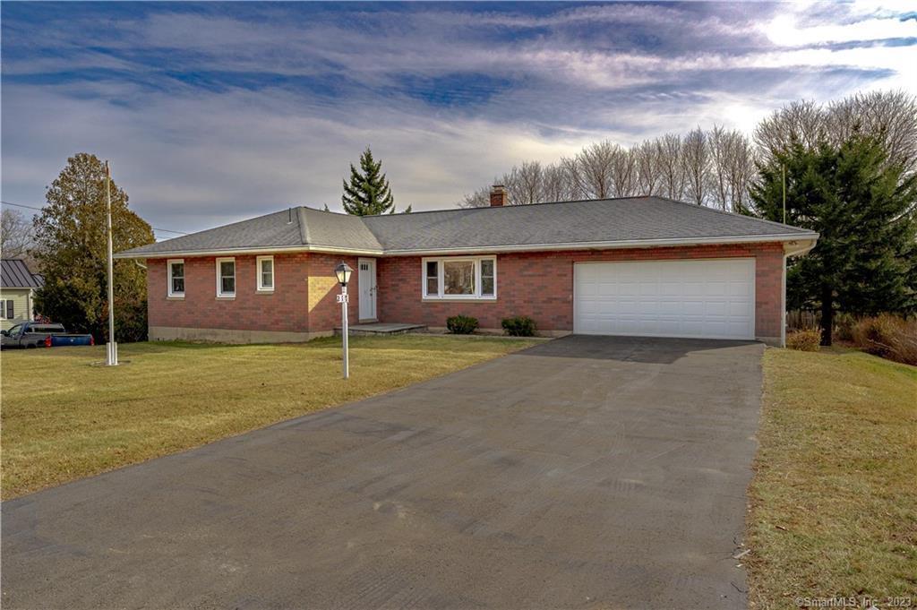 217 Beach Road Wolcott, CT 06716 - Photo 1 of 1 a front view of a house with a yard and garage