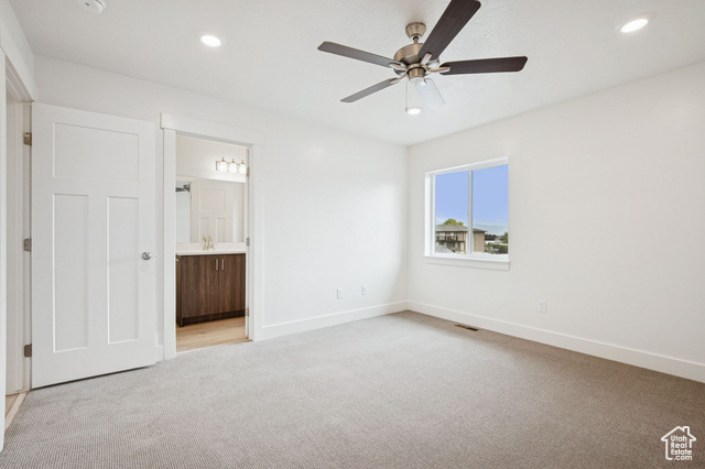 1615 North Angel Street, Unit H Layton, UT 84041 - Photo 28 of 55 Unfurnished bedroom featuring light colored carpet, recessed lighting, ceiling fan, and ensuite bath