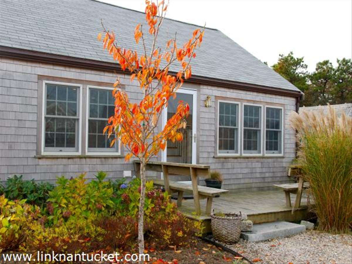 3 D Sun Island Road, Unit 1 Nantucket, MA 02554 - Photo 1 of 14 a front view of a house with a yard