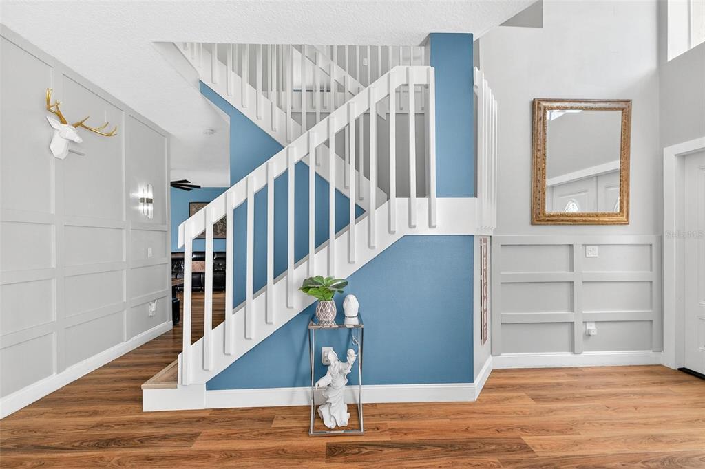 413 Rockafellow Way Orlando, FL 32828 - Photo 12 of 88 a view of entryway and hall with wooden floor