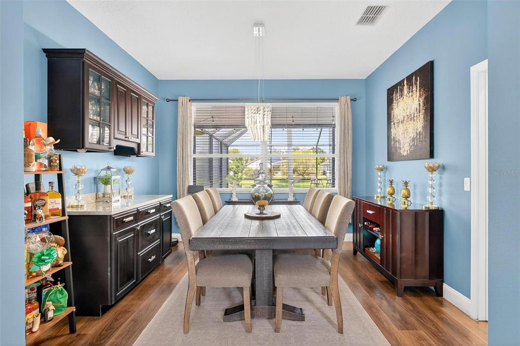 413 Rockafellow Way Orlando, FL 32828 - Photo 15 of 88 a view of a dining room with furniture window and wooden floor