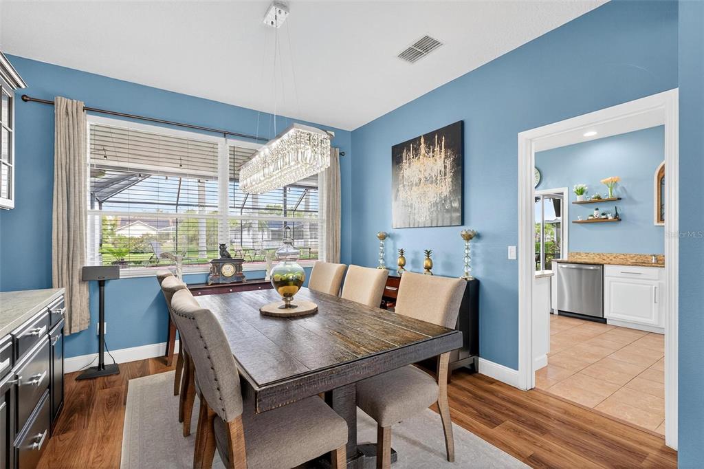 413 Rockafellow Way Orlando, FL 32828 - Photo 17 of 88 a view of a dining room with furniture window and wooden floor