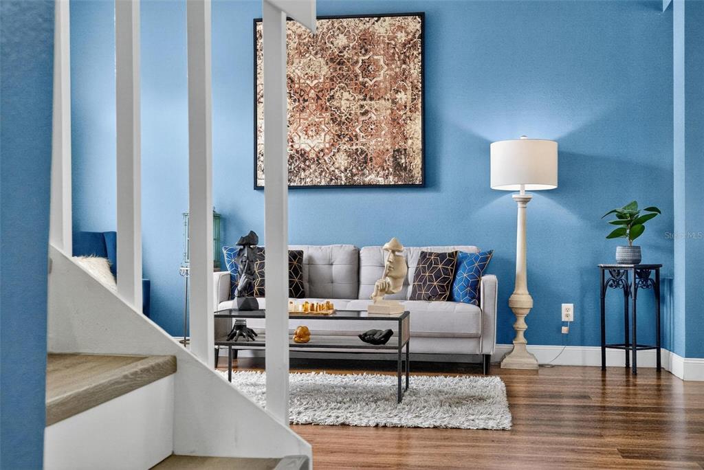 413 Rockafellow Way Orlando, FL 32828 - Photo 22 of 88 a living room with furniture and wooden floor