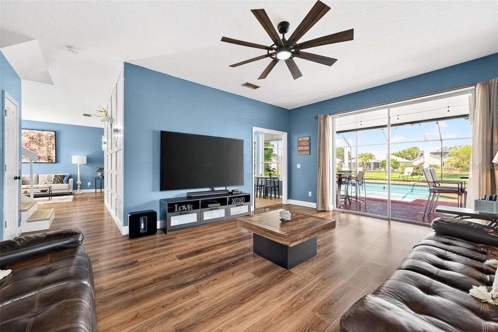 413 Rockafellow Way Orlando, FL 32828 - Photo 26 of 88 a living room with furniture and a flat screen tv