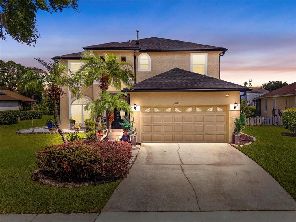 413 Rockafellow Way Orlando, FL 32828 - Photo 3 of 88 a front view of a house with a yard