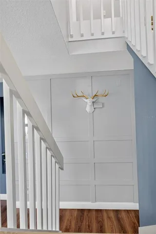 an aerial view of a house with swimming pool and a yard
