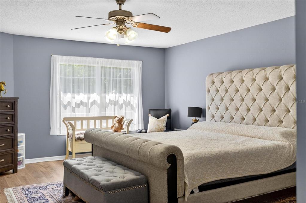 413 Rockafellow Way Orlando, FL 32828 - Photo 54 of 88 a bedroom with a bed and a couch