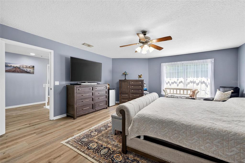 413 Rockafellow Way Orlando, FL 32828 - Photo 55 of 88 a bedroom with a bed and a flat screen tv