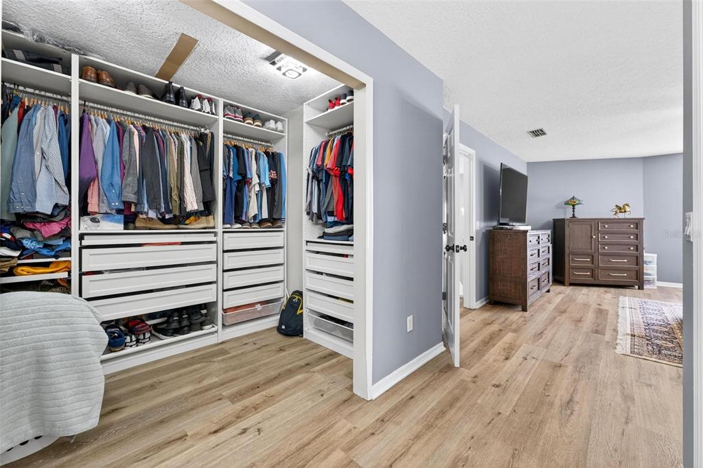 413 Rockafellow Way Orlando, FL 32828 - Photo 65 of 88 a view of walk in closet with clothes and shoes