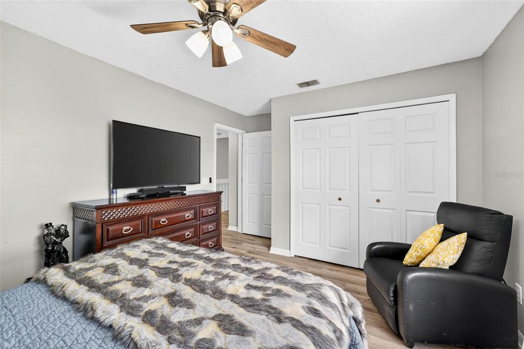 413 Rockafellow Way Orlando, FL 32828 - Photo 67 of 88 a bedroom with a bed and a flat screen tv