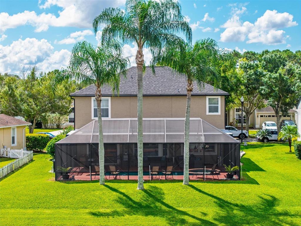 413 Rockafellow Way Orlando, FL 32828 - Photo 78 of 88 a view of a house with a swimming pool and a yard