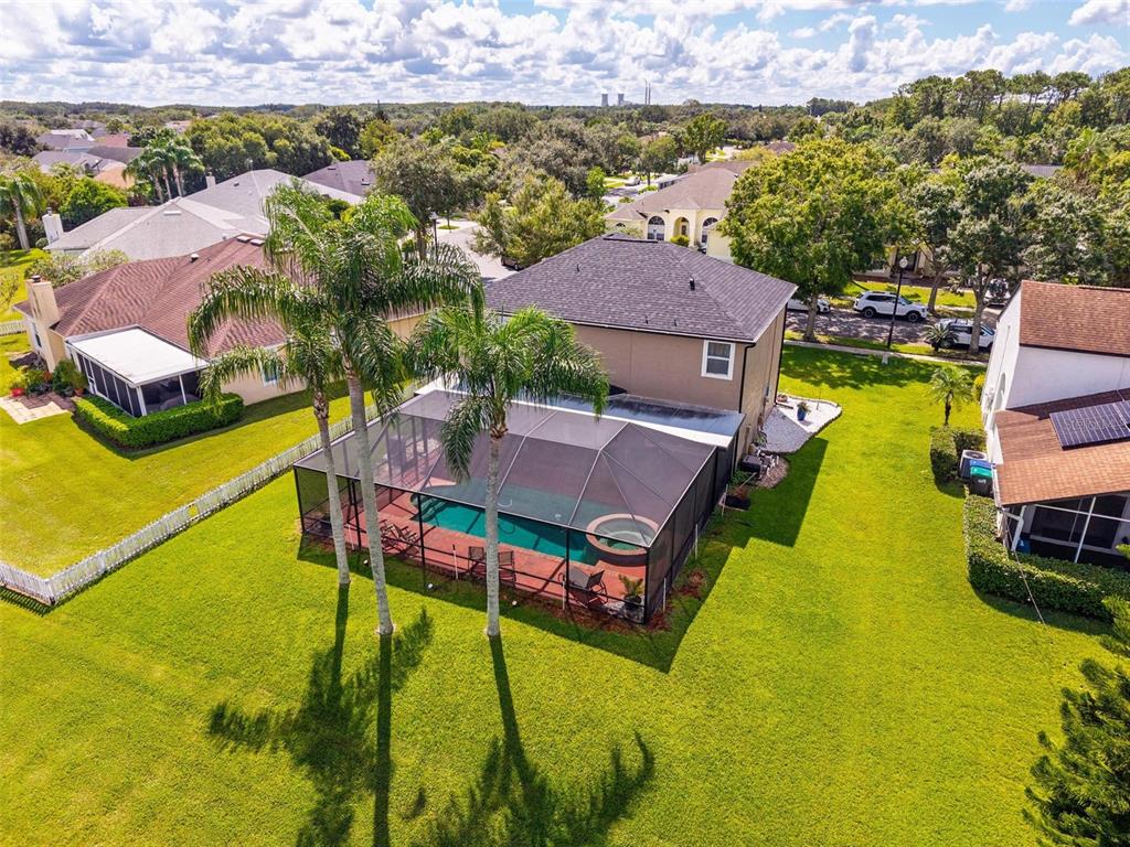 413 Rockafellow Way Orlando, FL 32828 - Photo 81 of 88 an aerial view of a house with swimming pool and a yard