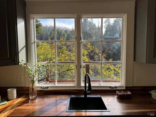 a view of a room with a large window