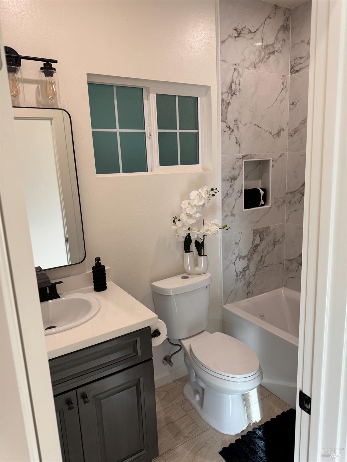 21883 Highway 116 Monte Rio, CA 95462 - Photo 18 of 28 a bathroom with a sink toilet and shower