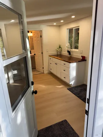 a bathroom with a double vanity sink and mirror