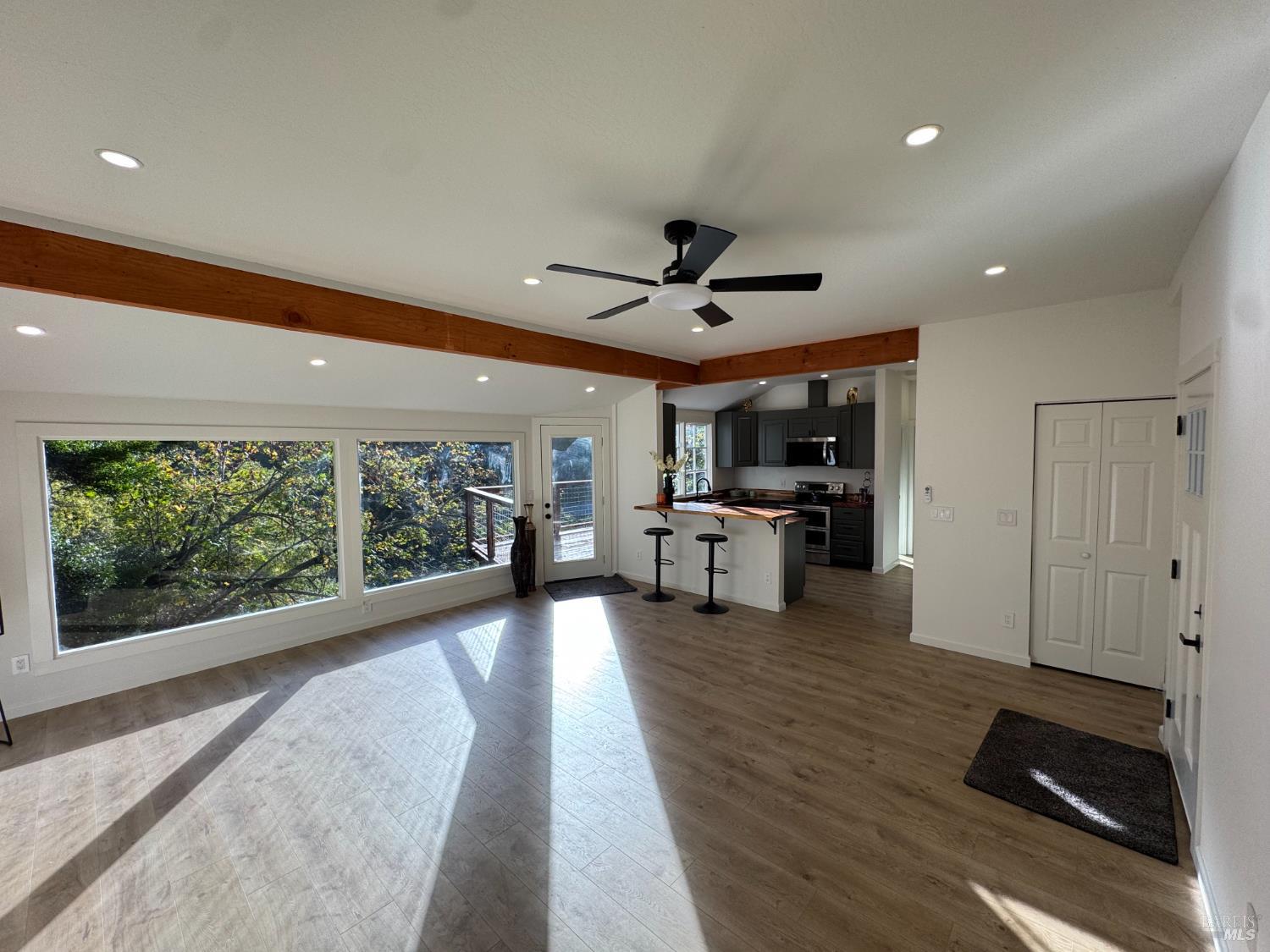 21883 Highway 116 Monte Rio, CA 95462 - Photo 9 of 28 a living room with furniture and a large window