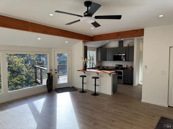 a kitchen with stove and refrigerator