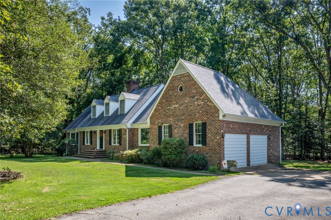 2409 Three Bridge Road Powhatan, VA 23139 - Photo 6 of 39 Brick exterior featuring a gabled roofline, multip