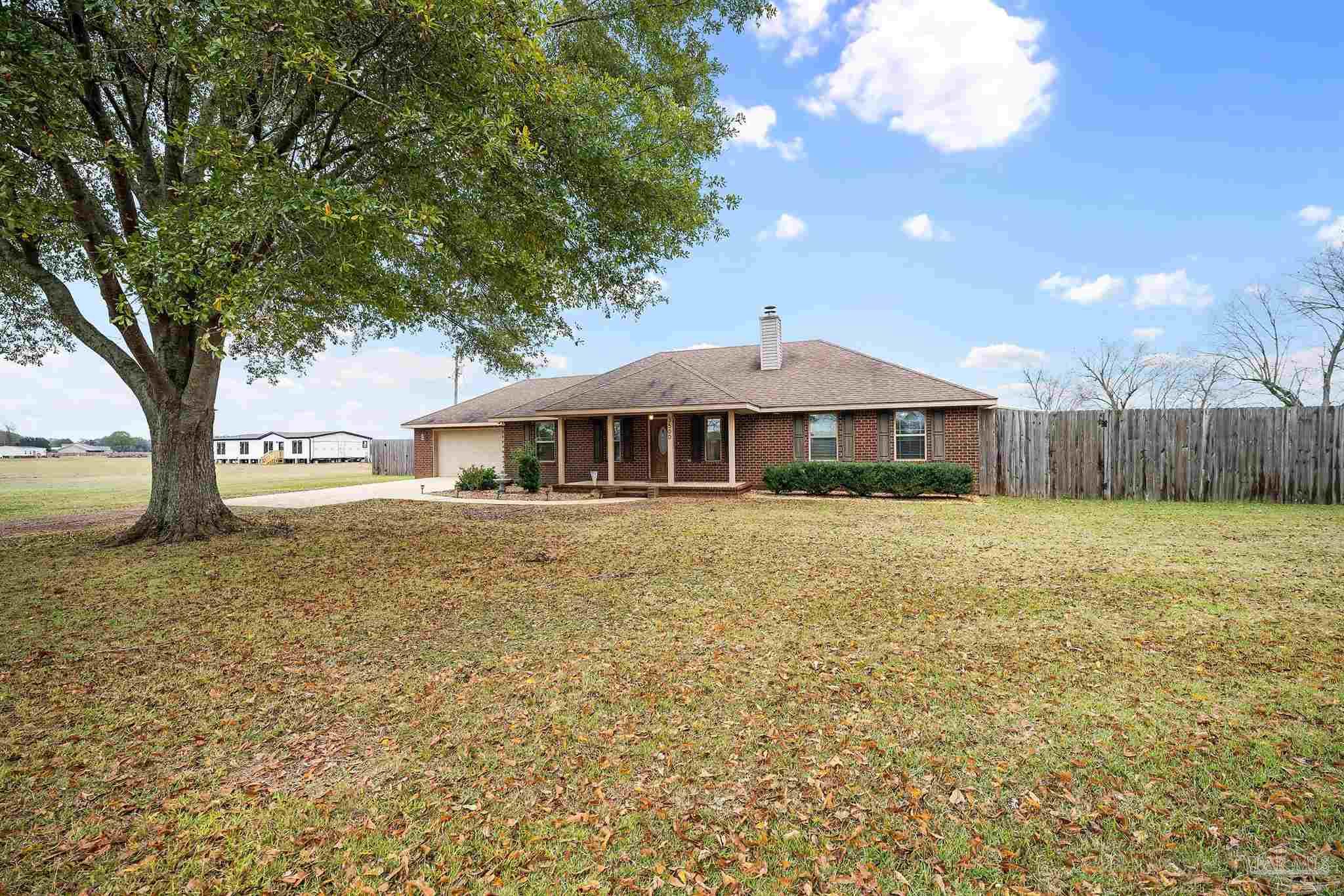 3500 Hazel Godwin Road Jay, FL 32565 - Photo 14 of 67 a front view of a house with a yard
