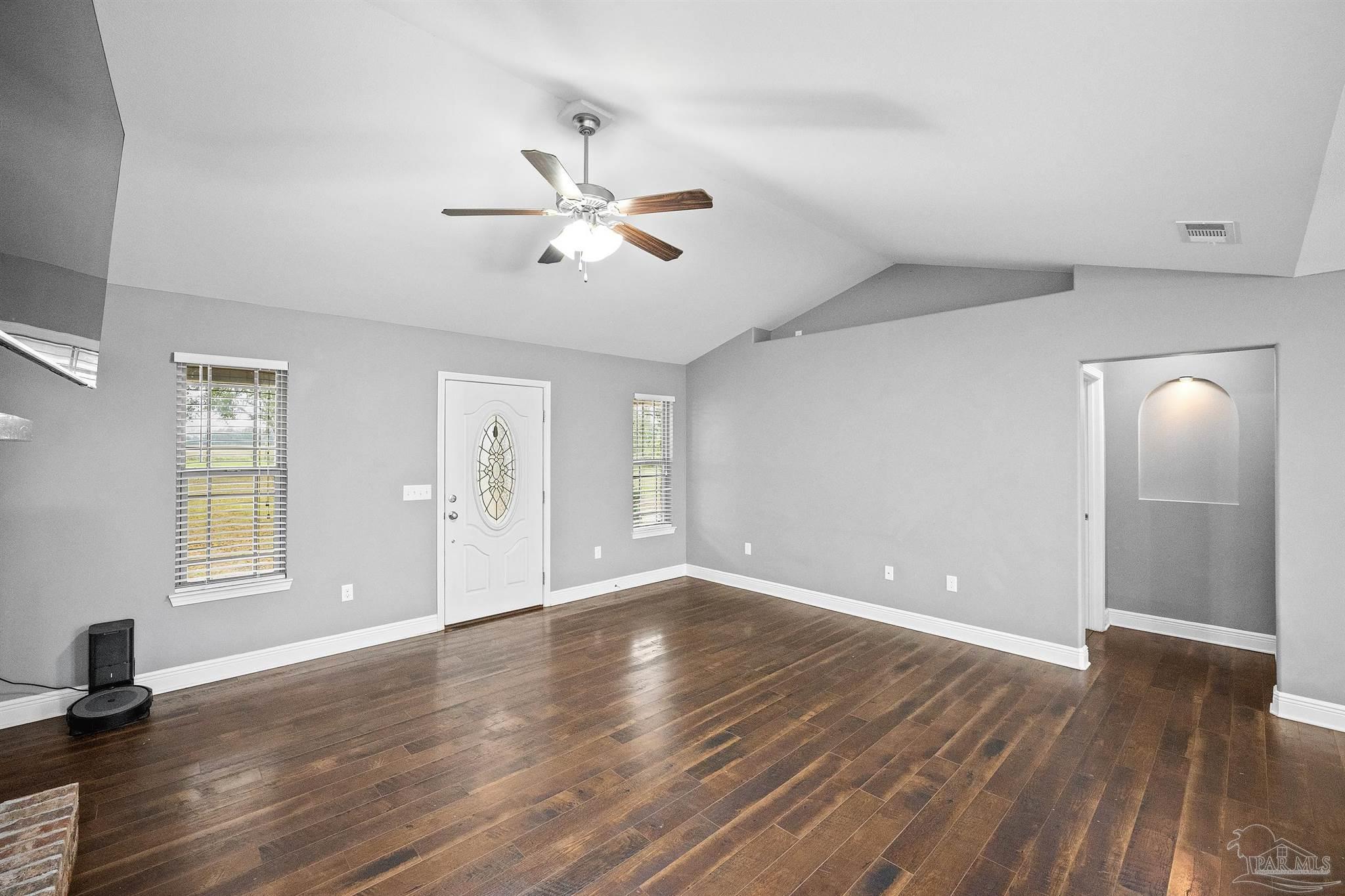 3500 Hazel Godwin Road Jay, FL 32565 - Photo 25 of 67 a view of an empty room with a window and wooden floor