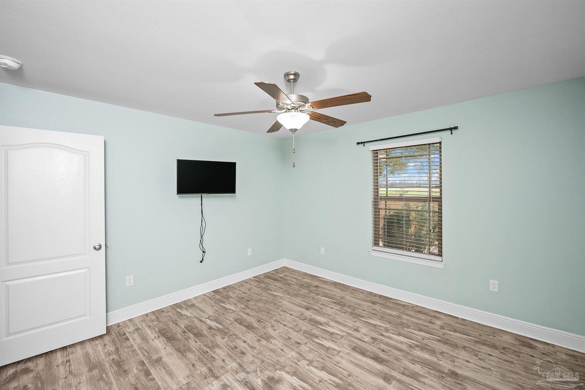 3500 Hazel Godwin Road Jay, FL 32565 - Photo 27 of 67 a view of an empty room with window and a ceiling fan
