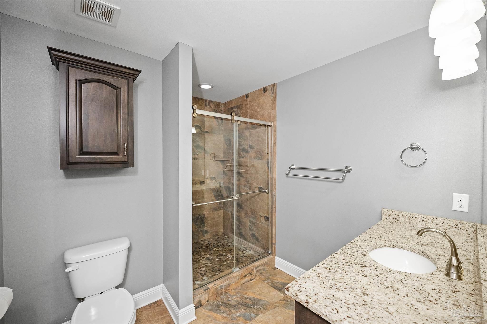 3500 Hazel Godwin Road Jay, FL 32565 - Photo 30 of 67 a bathroom with a toilet sink and shower