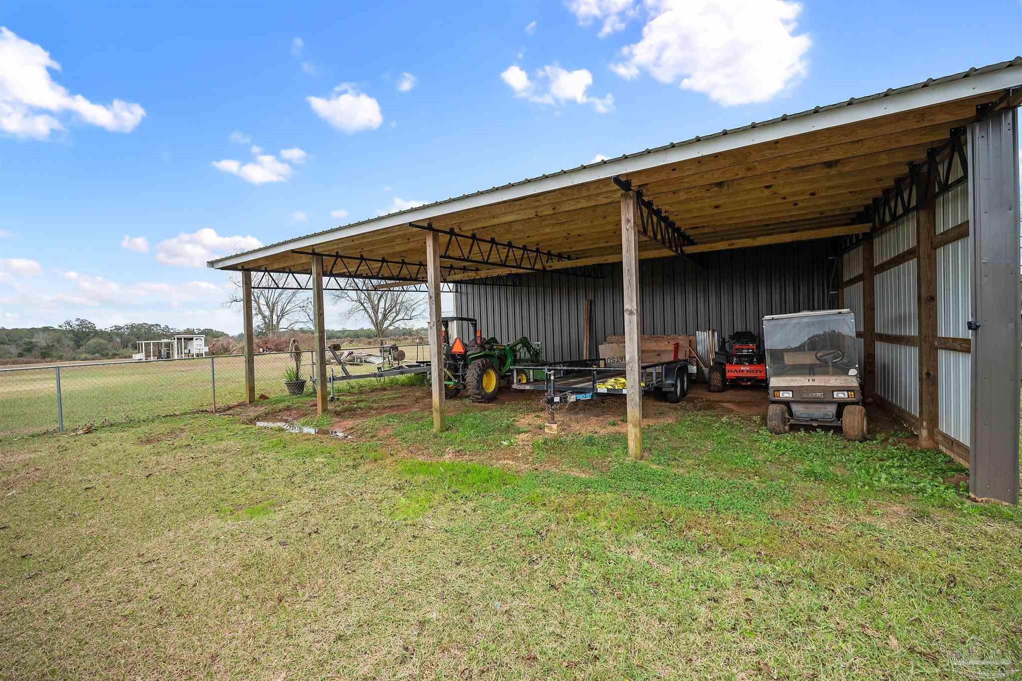 3500 Hazel Godwin Road Jay, FL 32565 - Photo 52 of 67 a view of a backyard with table and chairs