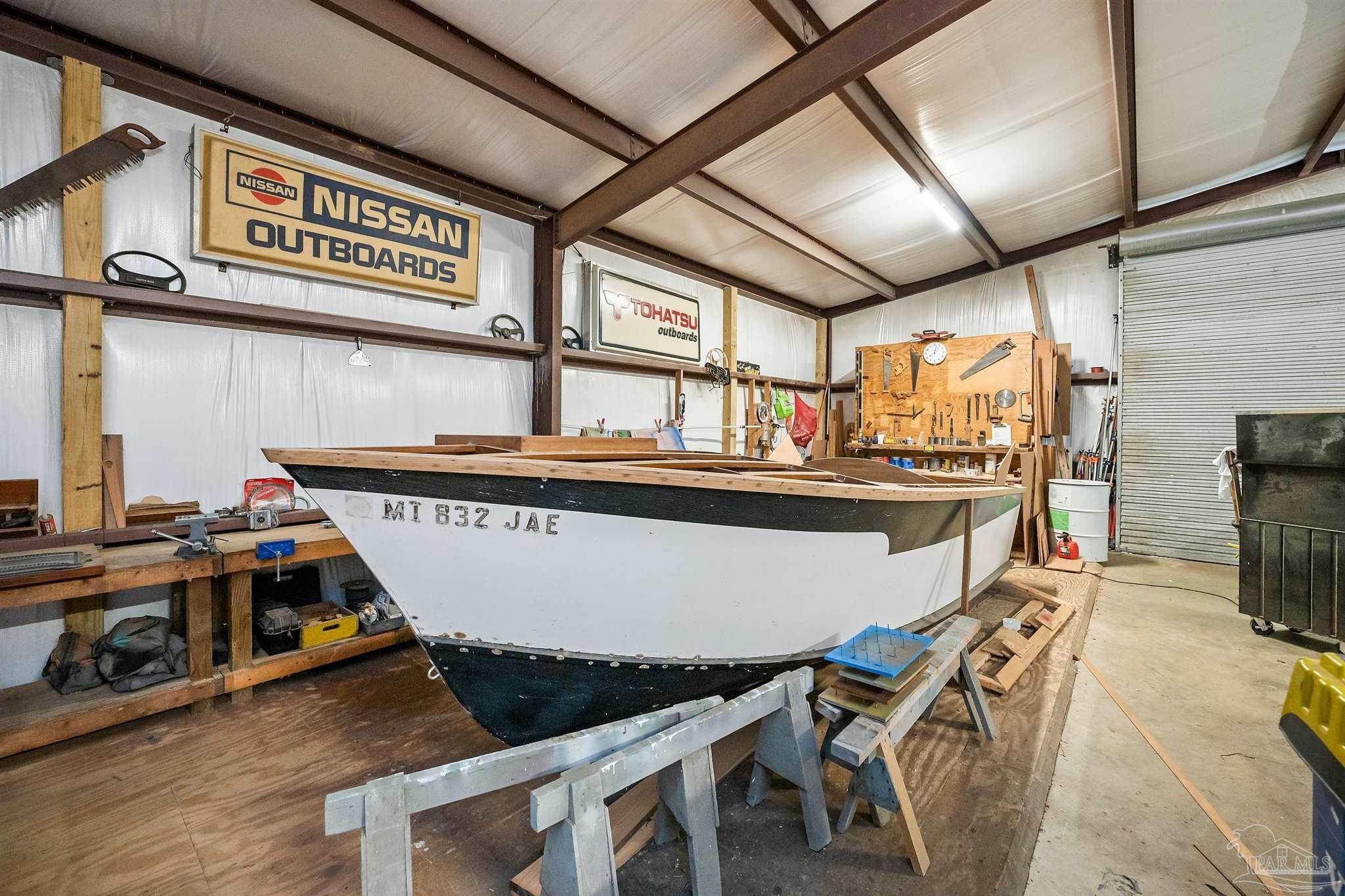 3500 Hazel Godwin Road Jay, FL 32565 - Photo 61 of 67 a view of a dining room with furniture a fireplace and wooden floor
