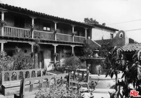 a view of a patio with table and chairs and potted plants