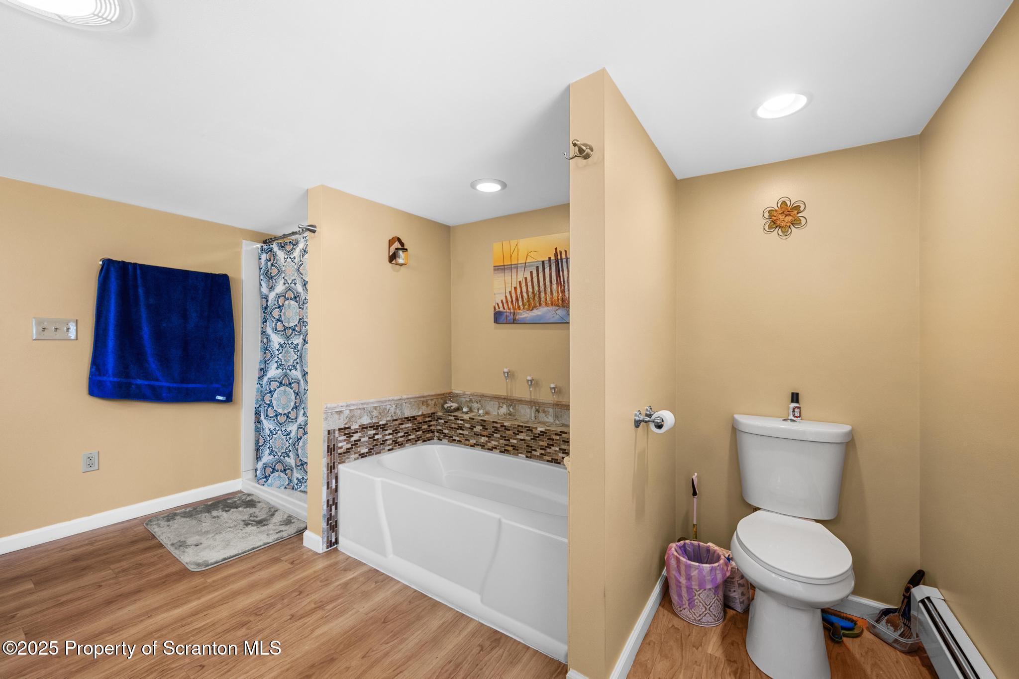 205 South Valley Avenue Olyphant, PA 18447 - Photo 16 of 44 a bathroom with a toilet a sink and a bathtub