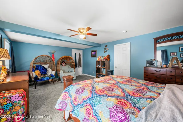 a bedroom with bed and window