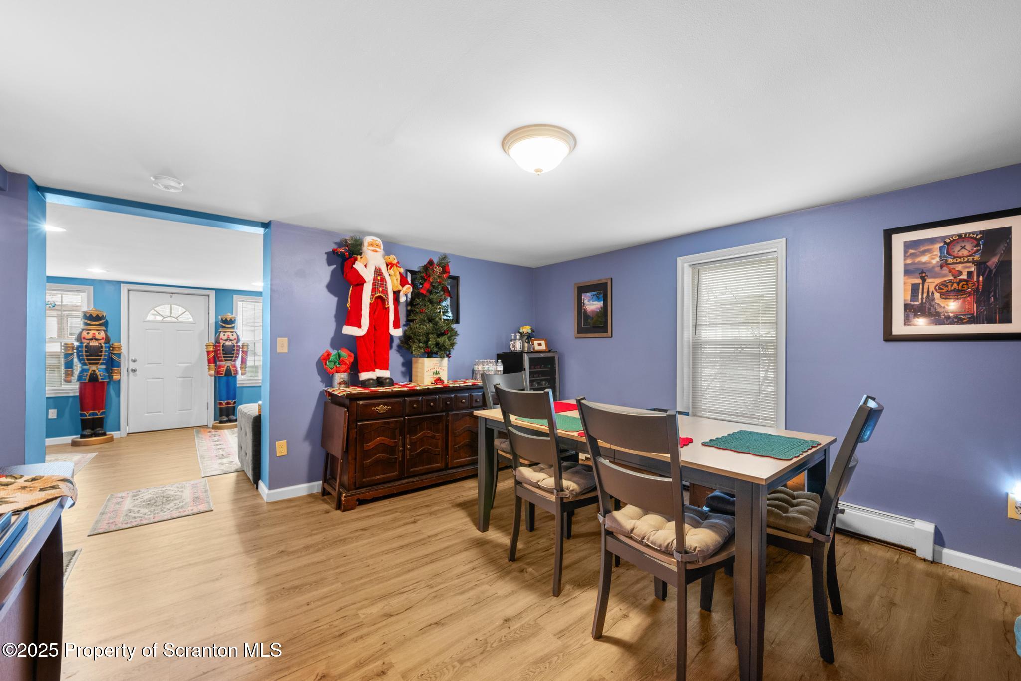 205 South Valley Avenue Olyphant, PA 18447 - Photo 22 of 44 a view of a dining room with furniture wooden floor and chandelier